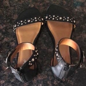 Black flat sandals with silver studs